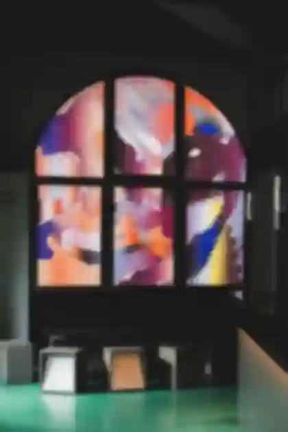 Large-format window art using backlit film, featuring an illuminated, abstract pixel-pattern design for Nuremberg's Blok bar.