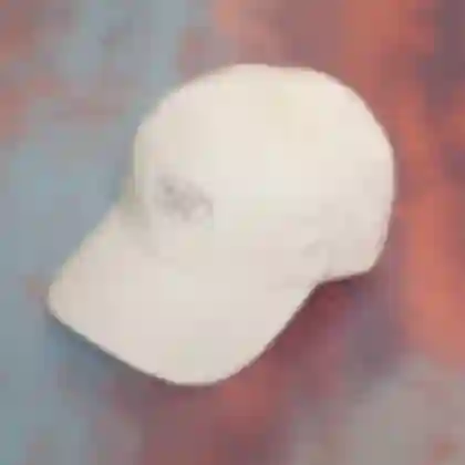 Beige baseball cap showcasing the multicoloured embroidered 'GOOD LIFE' logo design for Meike Männel.