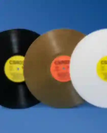 Mockup of vinyl color variations for ZEMENT PASSAGEN in gold, black and white.